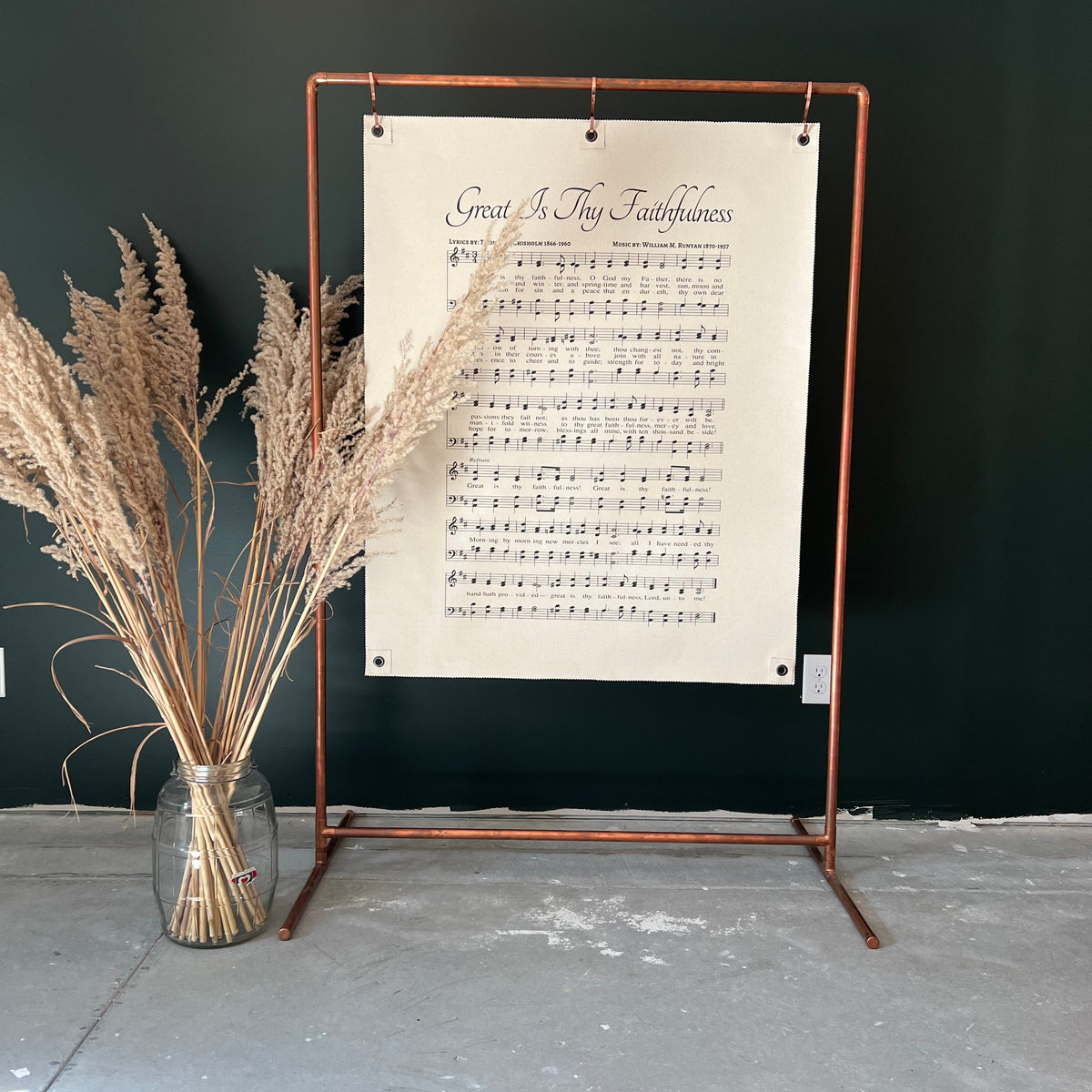 Great Is Thy Faithfulness hymn wall hanging displayed on a copper stand