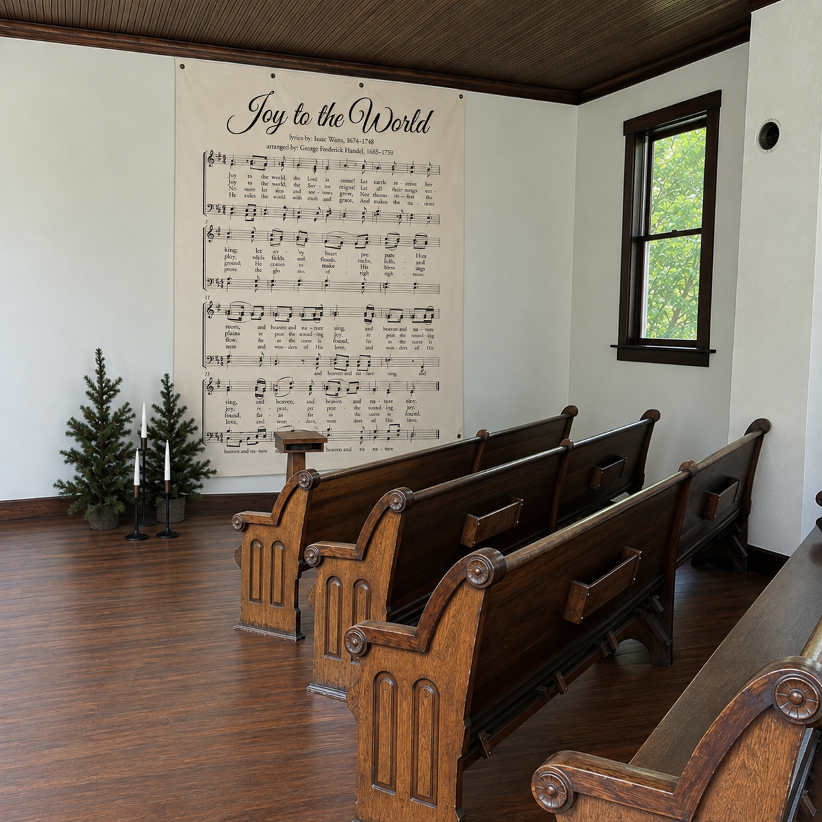 Joy to the World Christmas hymn wall canvas displayed in a church interior with wooden pews and a window.
