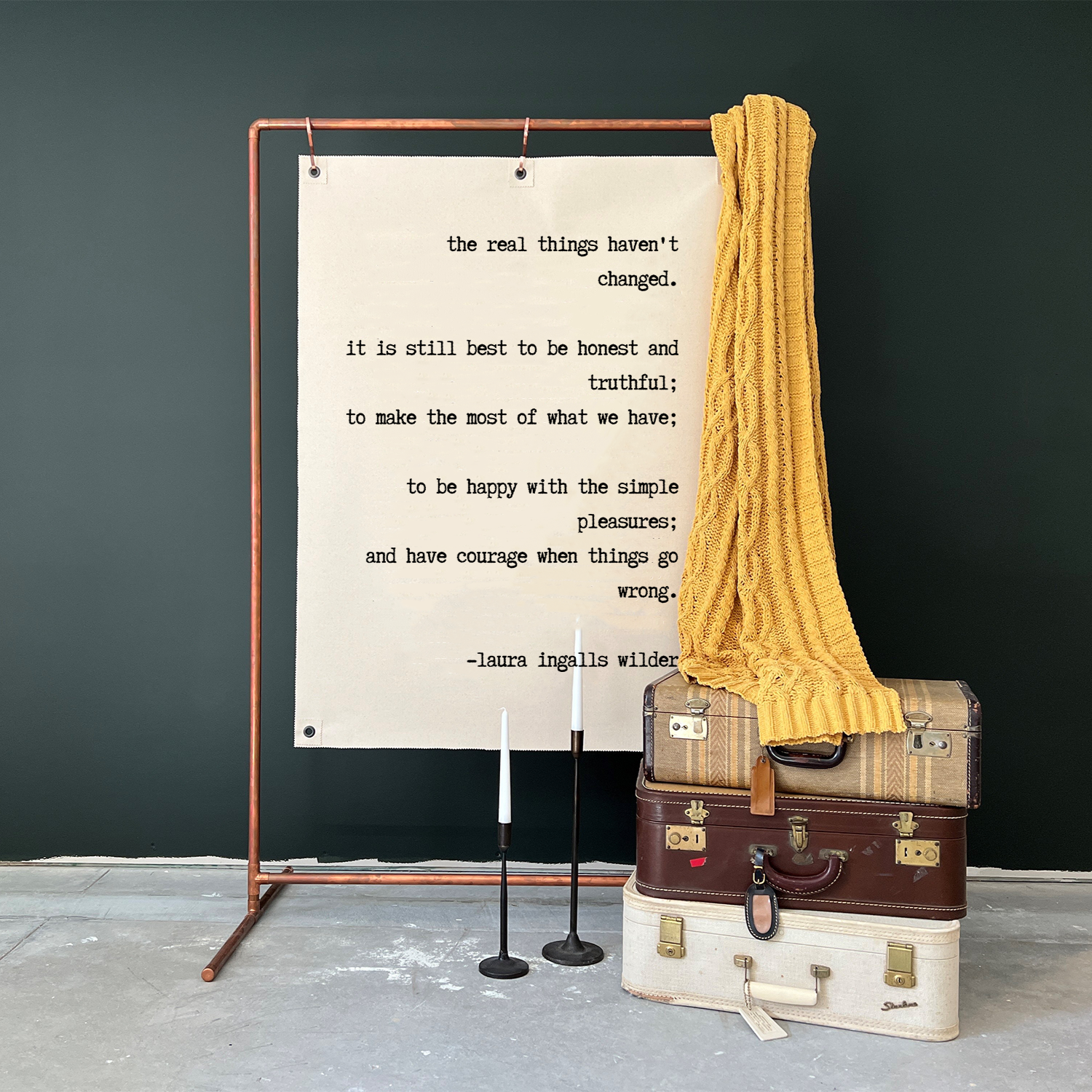 Wall Canvas with Laura Ingalls Wilder quote printed in black letters.